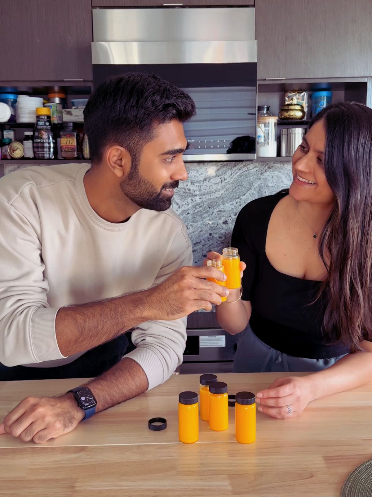 jahnvi and Harsh drinking ginger shots in their kitchen