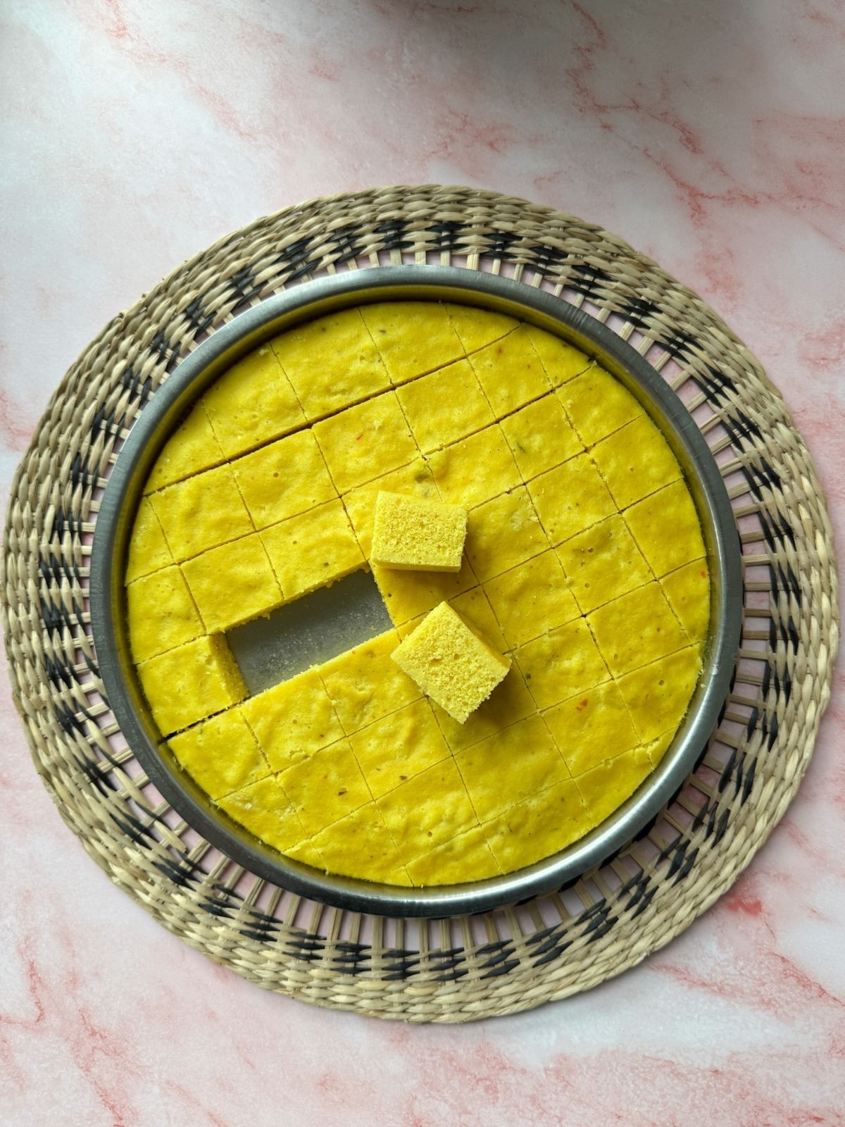 plate of freshly steamed khaman cut in cubes